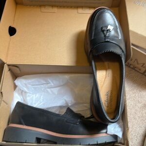 Size 7 Clarks collection shoes. They have never been worn.